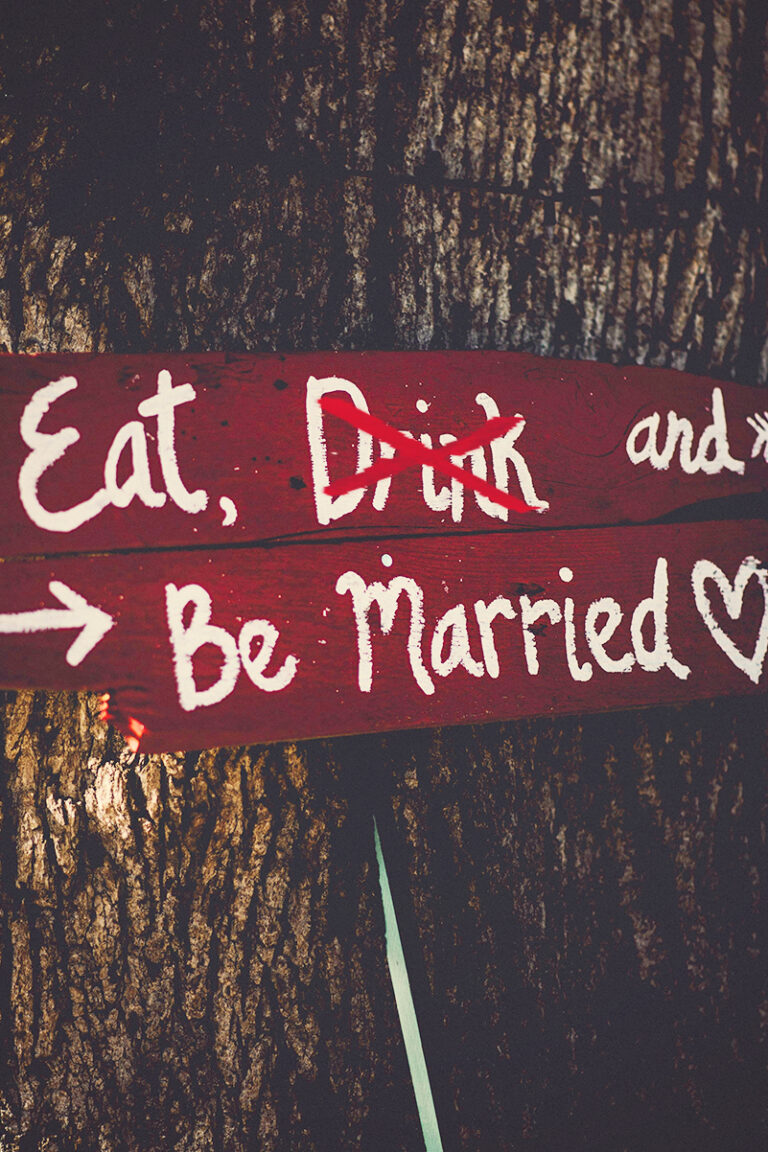 dry wedding sign reading "Eat, Drink, and be Married" with "drink" crossed out